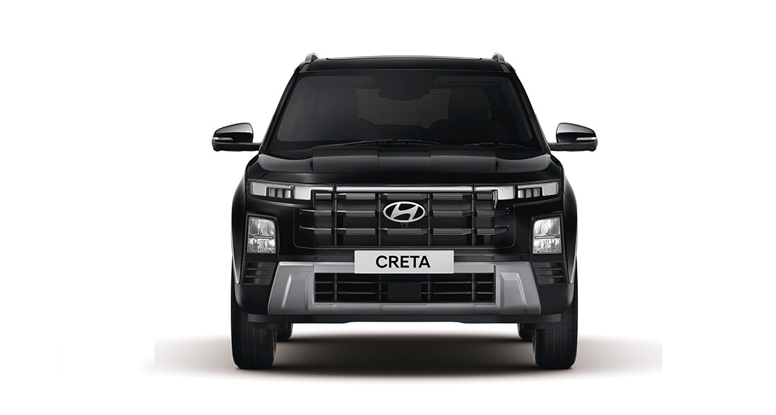 Side front view of navy Creta driving on a cloudy day