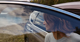 Car sunglasses storage box opened at the center of the front roof area