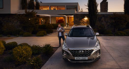 Right side rear view of silver Elantra parked in front of the building